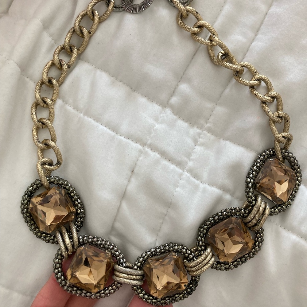 Large chain necklace with amber faux stones.